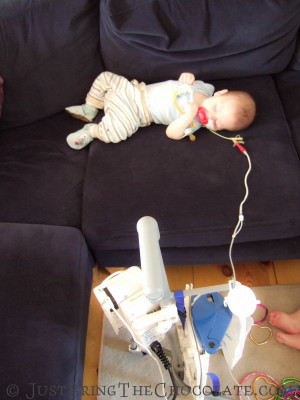 Dominic being fed with a feeding pump via a feeding pump