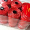 Rolls of red poo bags